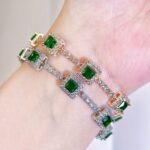 A Beautiful Green Cubic Zirconia Bracelet with a Silvery Golden Fashion Square Charm, Perfect for Women'S Evening Wear