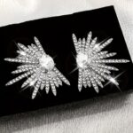A Pair of Dazzling Wing-Shaped Earrings Adorned with Rhinestones, Perfect for Women. These Elegant And Distinctive Bridal Earrings Are Trendy, Lightweight Statement Pieces Ideal for Proms And Parties