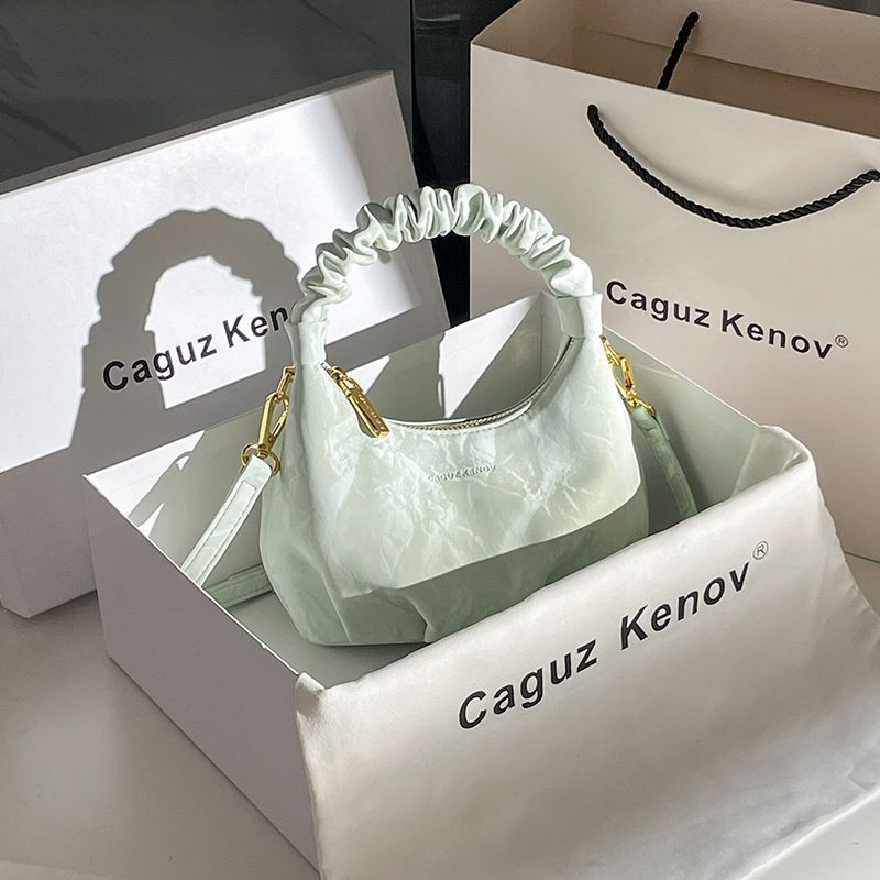 A Single Unit of The Latest Cloud Bag - a Small Pleated Clutch with an Adjustable Shoulder Strap, Featuring a Premium Matte End, Perfect for Everyday Use And Casual Events. This Compact Handbag Exudes Sophistication - Image 2