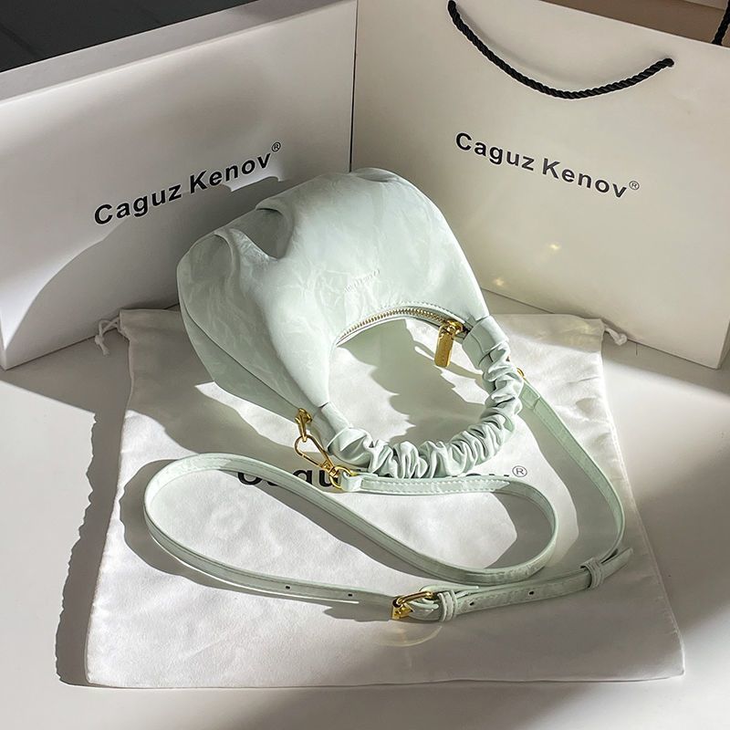 A Single Unit of The Latest Cloud Bag - a Small Pleated Clutch with an Adjustable Shoulder Strap, Featuring a Premium Matte End, Perfect for Everyday Use And Casual Events. This Compact Handbag Exudes Sophistication - Image 5