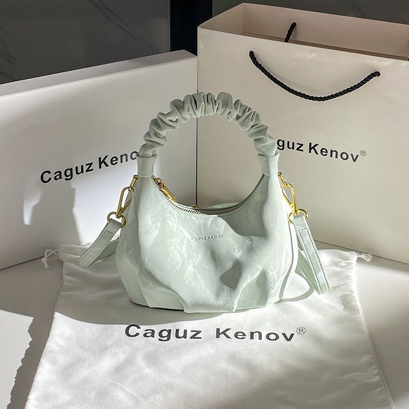 A Single Unit of The Latest Cloud Bag - a Small Pleated Clutch with an Adjustable Shoulder Strap, Featuring a Premium Matte End, Perfect for Everyday Use And Casual Events. This Compact Handbag Exudes Sophistication - Image 8